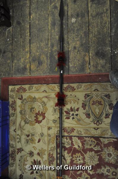 An African spear with wooden shaft and steel tip, 162cm overall.