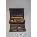 A Victorian rosewood drawing box with brass lozenge, fitted top drawer containing drawing