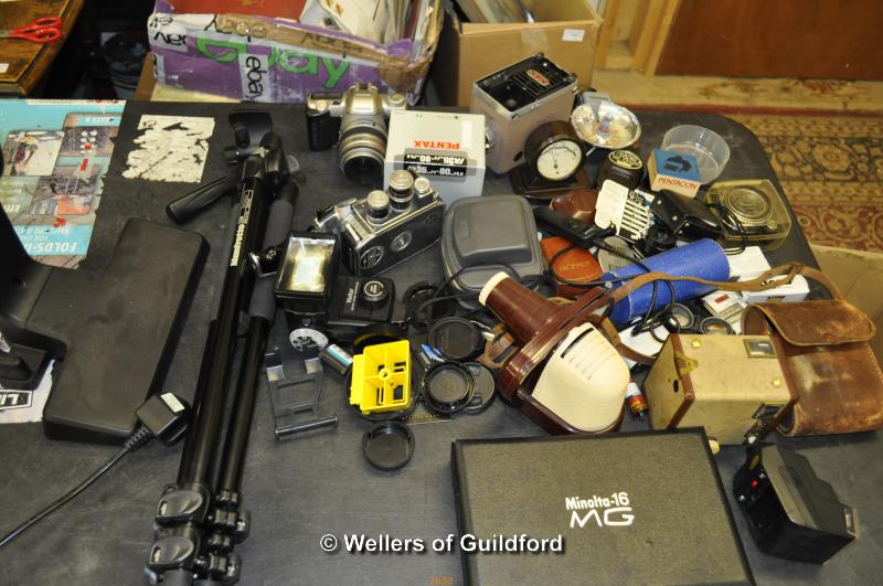 Quantity of camera accessories including tripod, flashes etc