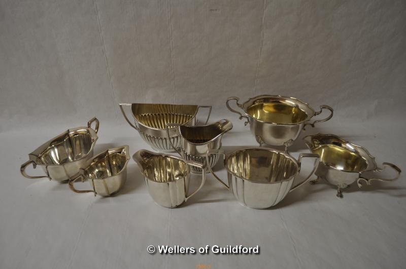 A group of silver plated three piece tea services and part tea services. - Image 4 of 4