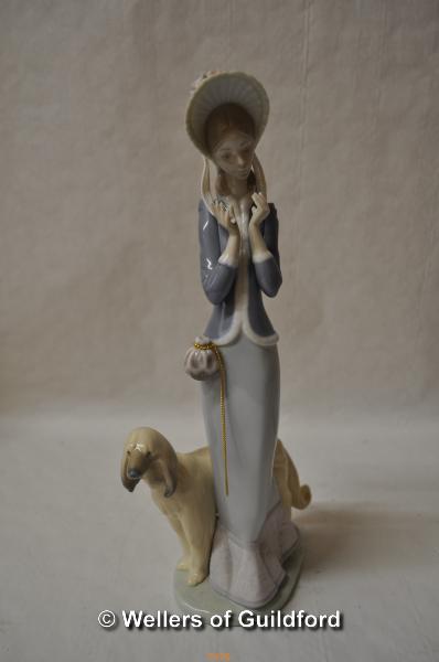 Lladro figure of a lady with an Afghan hound, 33cm.