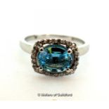 *2ct oval blue topaz and natural diamond Halo ring, 10K white gold (Lot subject to VAT)