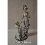 Lladro figure of a lady with feather headdress, holding a calla lily, an urnful of calla lillies