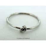 *Silver Kate Spade Knot Bangle. (Lot subject to VAT)