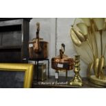 Two copper kettles, a brass trivet, an iron trivet, modern carriage clock, pair of brass candle