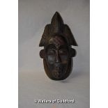 An ornamental African carved wooden mask, 46.5cm.