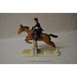 Beswick figure of a lady riding sidesaddle jumping over a fence, 26cm.