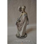 Lladro figure of a lady in flowing dress beside an urn of foliage, 34cm.