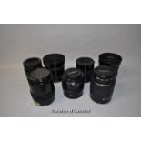 Seven Minolta camera lenses; models AF Zoom 35-80mm 1:4(22)-5.6 (82212909); AF Zoom 35-105mm 1:3.5(
