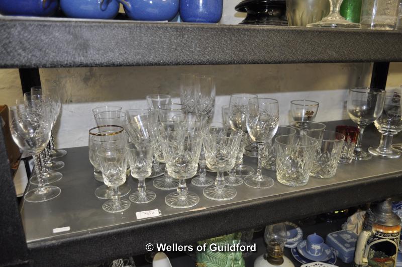 A quantity of stemware and an amber coloured glass bell.