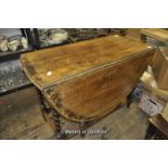 An oak oval gateleg dining table.