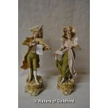 A pair of Royal Dux classical figurines, impressed numbers 391 and 392, he is playing the fiddle and