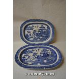 A near pair of blue and white meat plates.