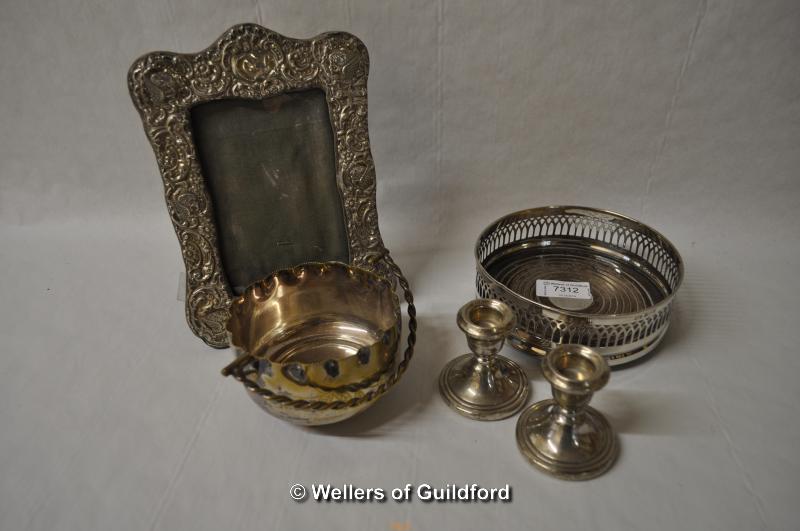 Silver: bottle coaster with wooden base, Birmingham 1973; pair of dwarf candlesticks, Birmingham