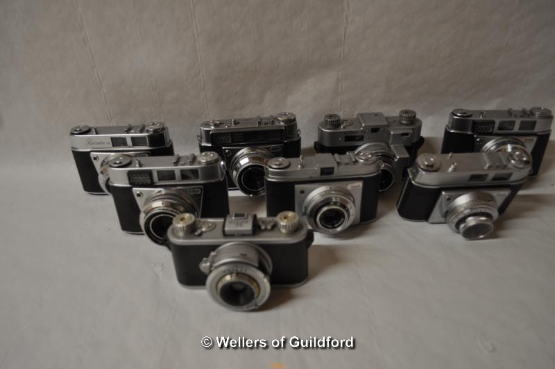 Eight Kodak cameras with lenses. Camera bodies include - Retinette (x2), 35 (x2), Retinette IA,