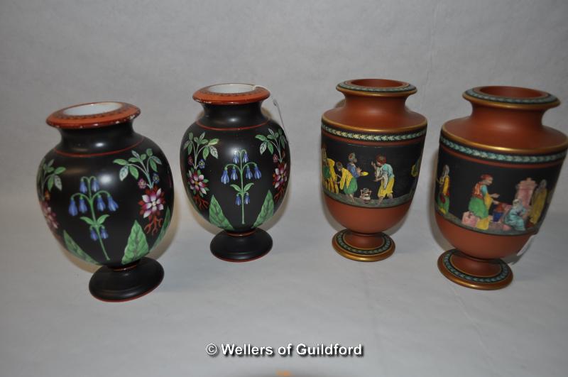 A pair of Victorian vases of globular form, the black ground painted with flowers, 15cm; a pair of