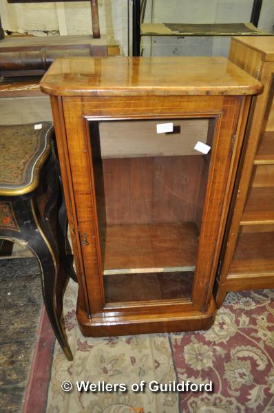 A Victorian walnut music cabinet with single glazed door enclosing shelves, 51cm wide