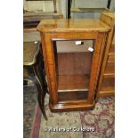 A Victorian walnut music cabinet with single glazed door enclosing shelves, 51cm wide