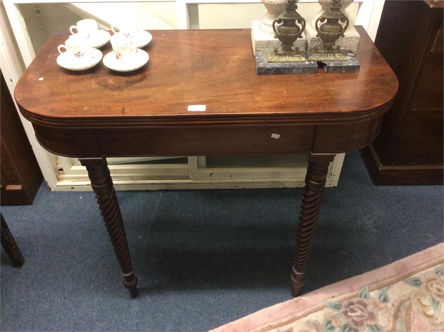 A mahogany hinged top games table.