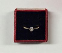 A small diamond single stone ring in 18 carat claw