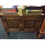 An oak Jacobean style cupboard.