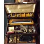 A large box of costume jewellery.