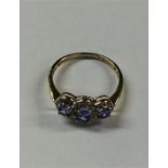 A sapphire and diamond triple cluster ring in 9 ca