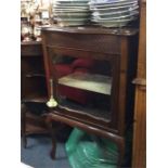 An Edwardian mahogany cabinet.