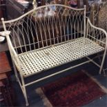 A metal two seater garden bench.