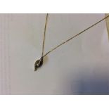 A small 18 carat gold diamond single stone pendant
