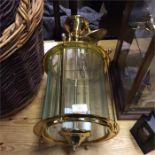 A large brass mounted ceiling light pendant.