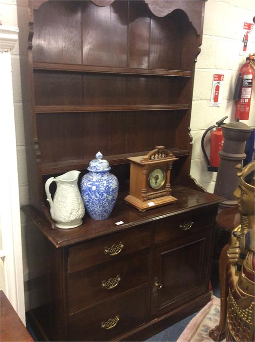 An oak four drawer dresser.