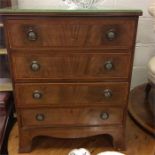 A mahogany chest of four drawers with plate glass