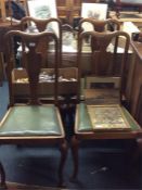 A set of four Queen Anne style dining chairs.