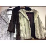 Three fur coats.