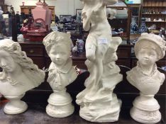 Four alabaster busts.