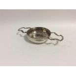 A good quality lemon strainer with scroll decorate