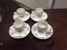A set of four Royal Worcester coffee cups and sauc