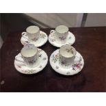 A set of four Royal Worcester coffee cups and sauc