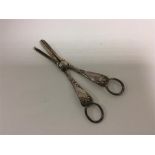 A pair of good embossed grape scissors with ring h