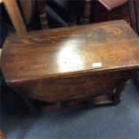 A small oak drop leaf table.