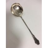 A Continental silver serving spoon with engraved d