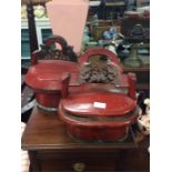 A pair of red lacquered Oriental baskets.