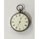 A small silver fob watch with gold hinges.