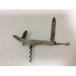 A novelty flick knife mounted with a corkscrew wit