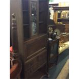 A stylish oak lead glazed bureau bookcase.