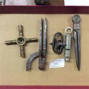 A box containing compasses, whistles and watch key