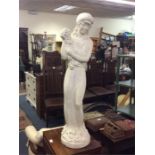 A large alabaster figure of a lady.