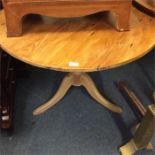 A small pine single pedestal table.