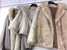 Three fur coats.
